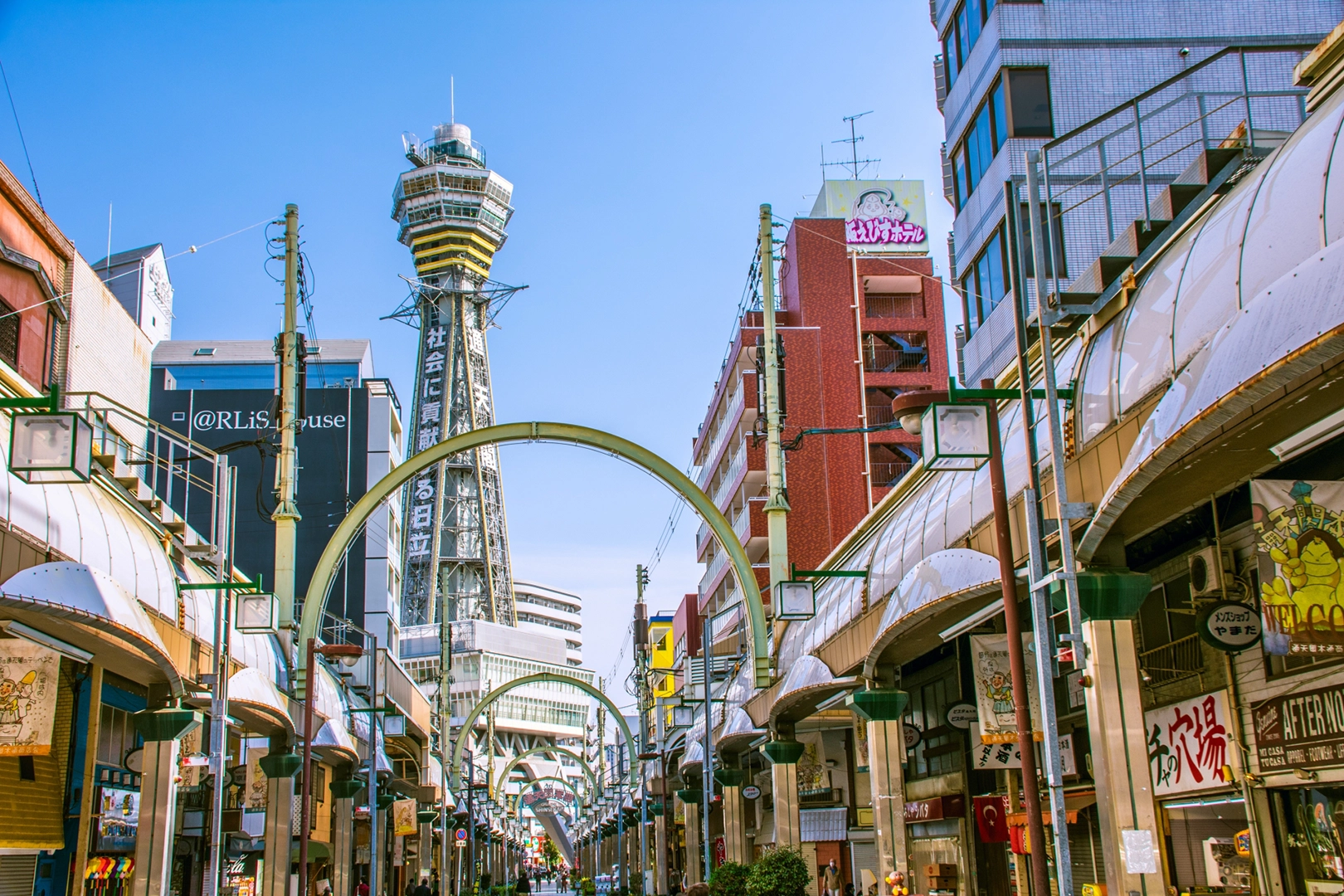 Tsutenkaku standing in Shinsekai, a neighborhood known for its retro atmosphere and distinctive character