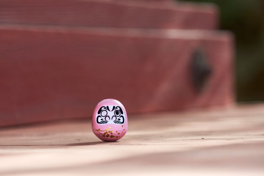 Pink Daruma in a Japanese garden
